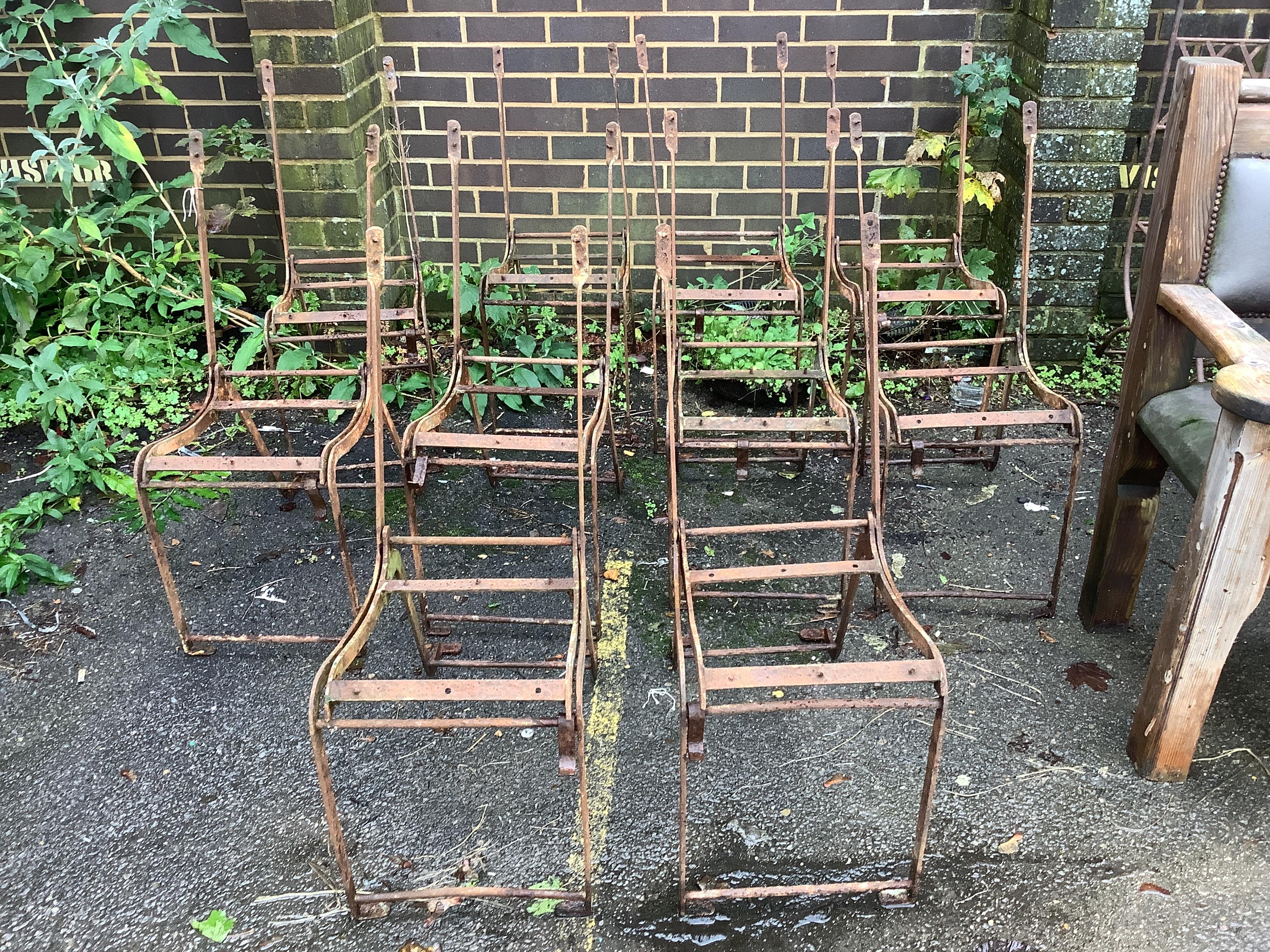 A set of ten metal folding garden chair frames
